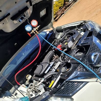 HVAC technician performing air conditioning maintenance Harare Zimbabwe